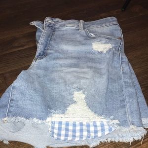 Ripped blue jean shorts